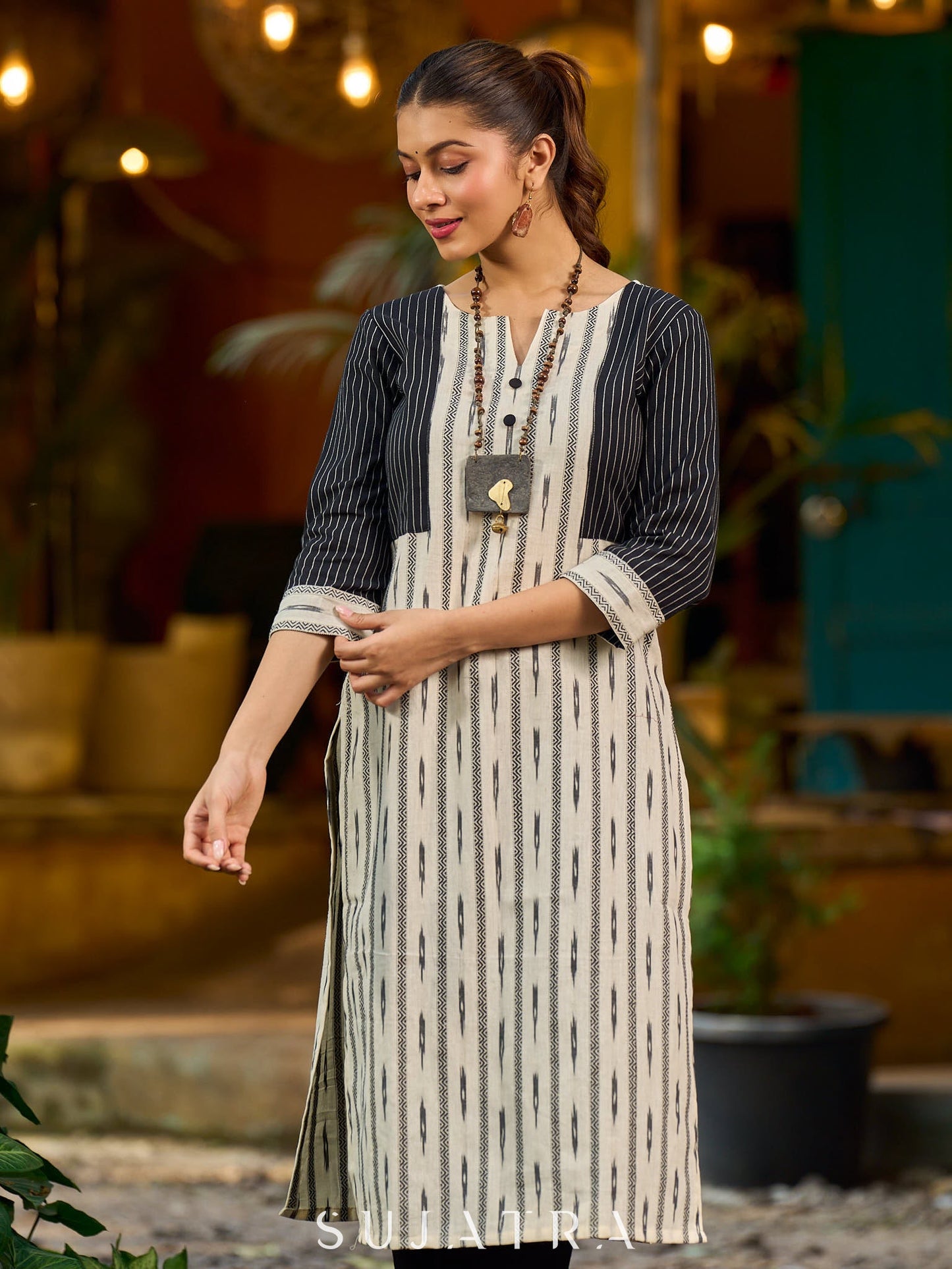 Timeless monochrome Ikat kurta enhanced with stripe details.