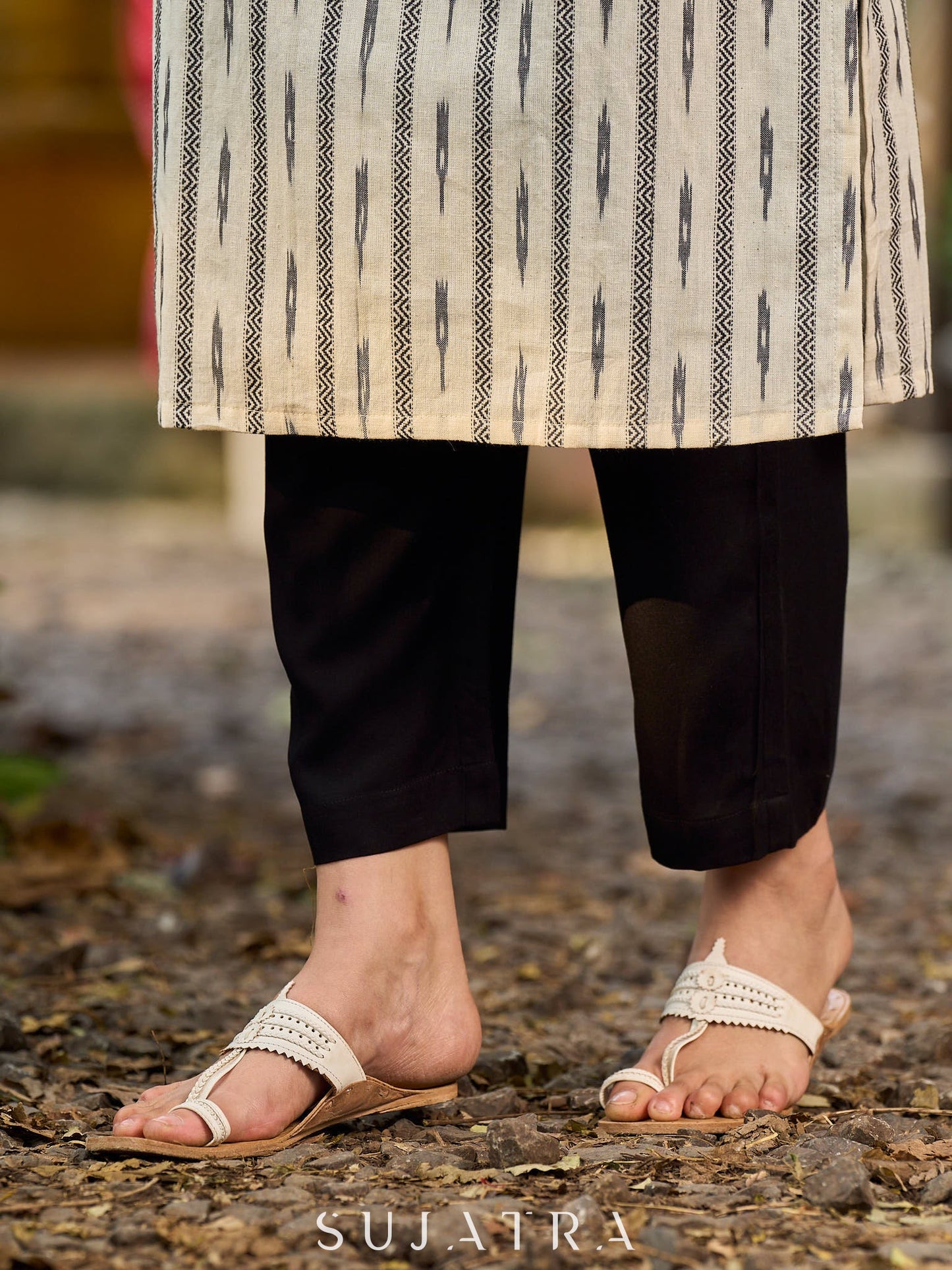 Timeless monochrome Ikat kurta enhanced with stripe details.