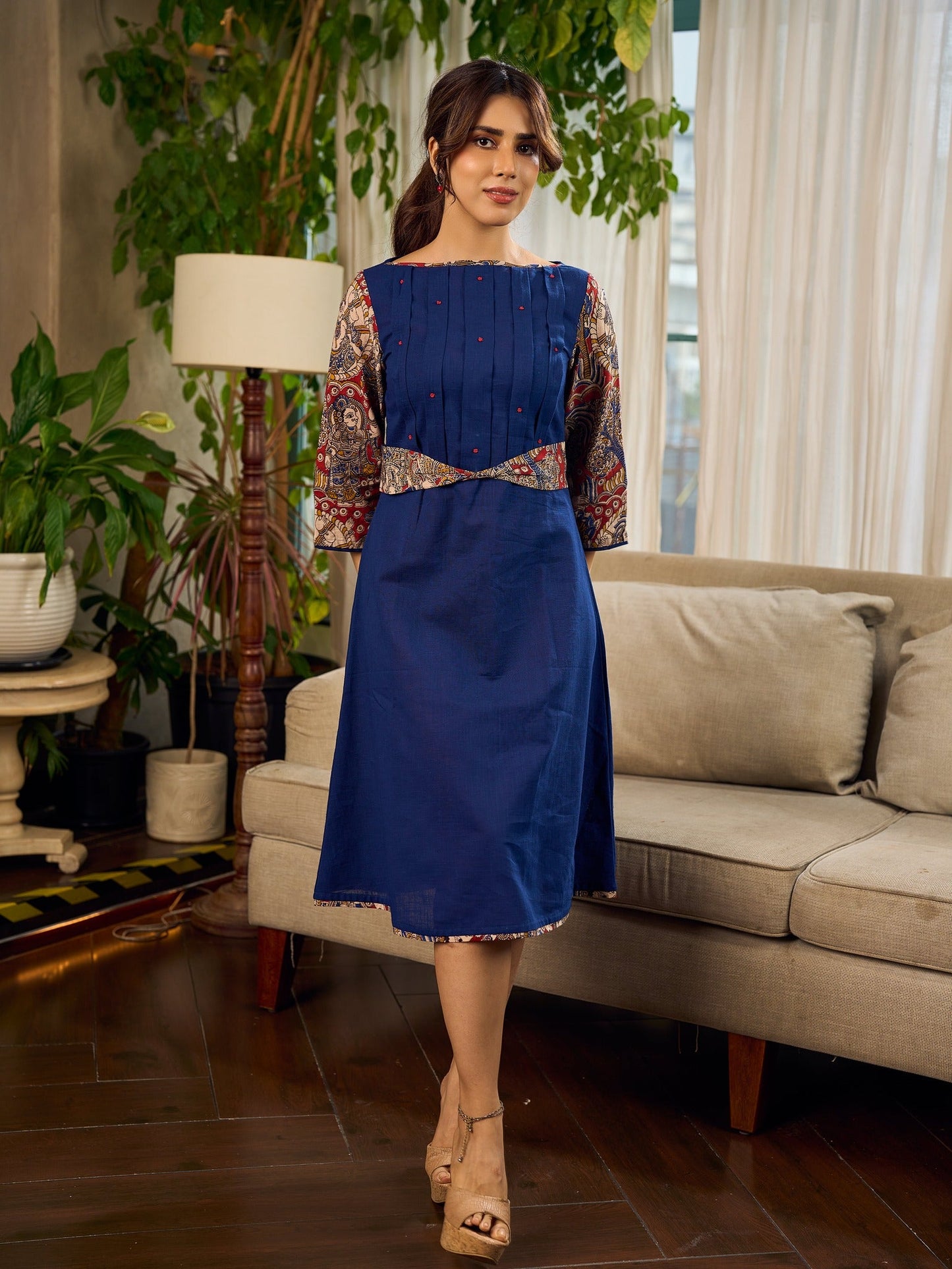 Navy Blue Artisanal Kalamkari prints enhanced with statement sleeves and a waist-defining knotted Kalamkari belt.