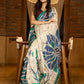 Classic ivory pure silk saree highlighted by teal borders and hand batik artistry