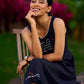 Graceful Black Rayon Pleated Dress with Script Art and Painted Hemline