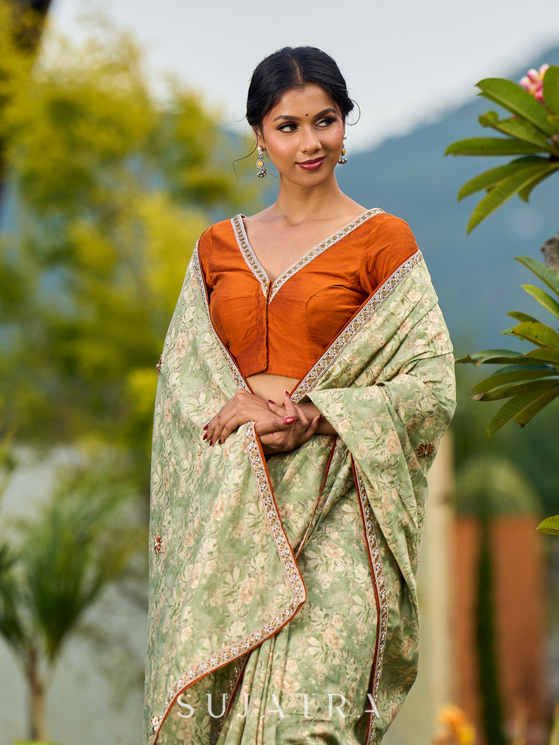 Enchanting Sage Green Saree with All-Over Foil Floral Print & Golden-Orange Trim Detail with Hand Embroidered Pallu