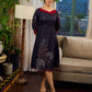 Elegant black Kalamkari-inspired dress with deep maroon accents and graceful floral motifs.