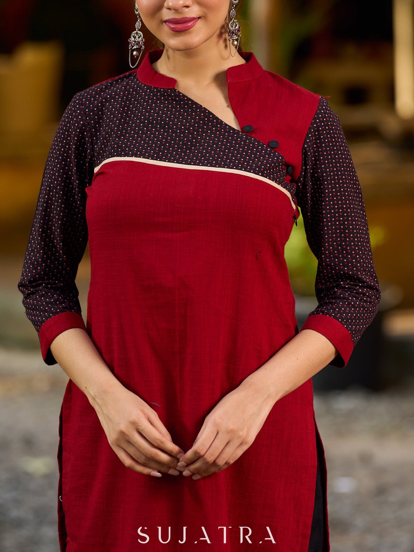Elegant Ajrakh polka dot kurta with bold black maroon tones and an asymmetrical neck.