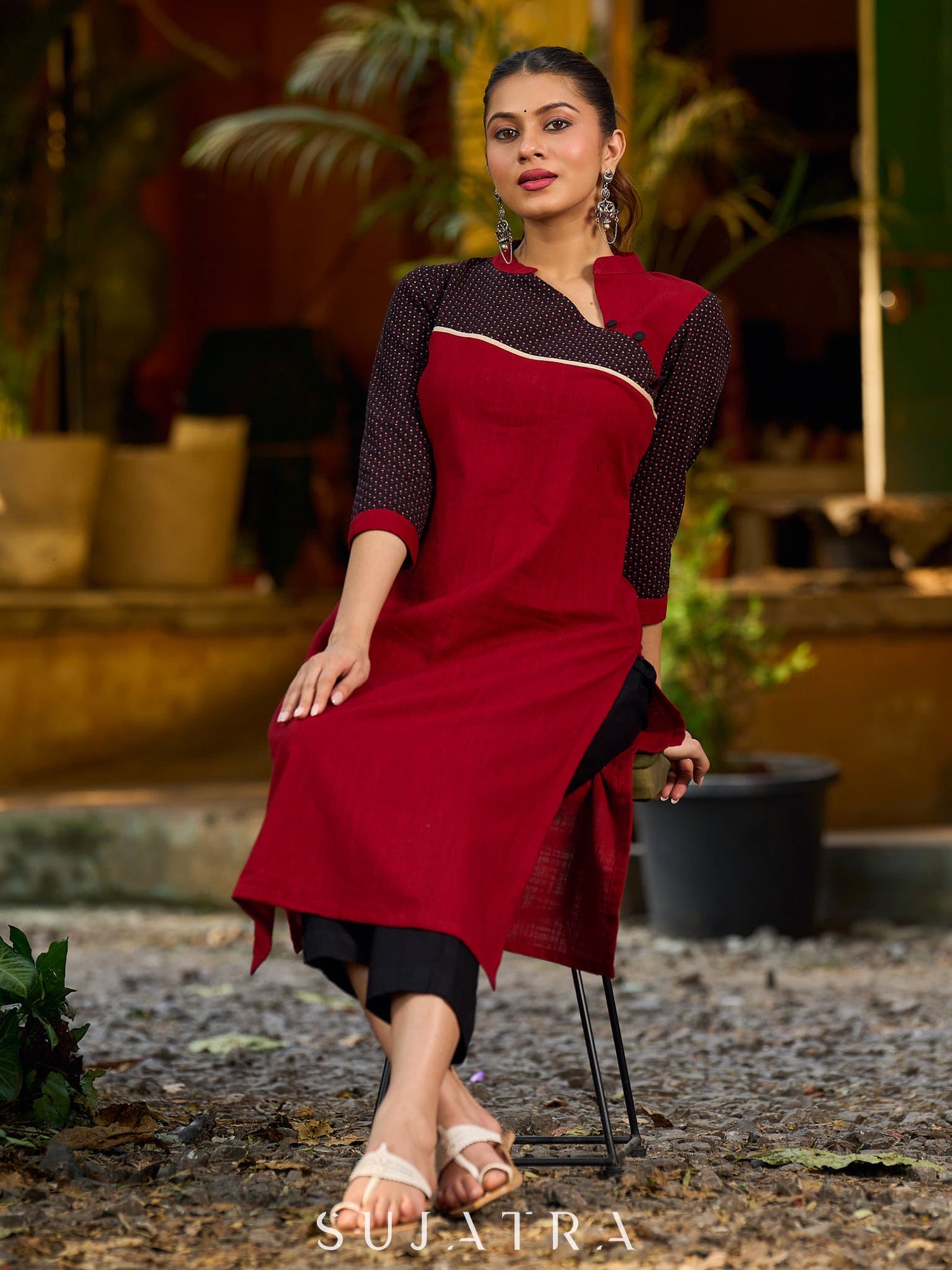 Elegant Ajrakh polka dot kurta with bold black maroon tones and an asymmetrical neck.