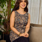 Stunning black Kalamkari overlap dress featuring a chic asymmetrical gathered hem.