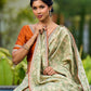 Enchanting Sage Green Saree with All-Over Foil Floral Print & Golden-Orange Trim Detail with Hand Embroidered Pallu