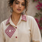 Vibrant ivory hand block print shirt featuring geometric motifs, magenta accents, and a contemporary silhouette inspired by traditional craftsmanship.
