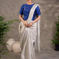 Blouse en mélange de coton et soie bleu roi, manches courtes, col et bordures de manches brodés de miroirs