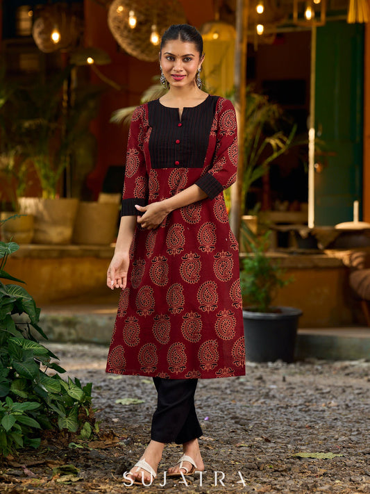 Stunning maroon Ajrakh kurta with an artisanal black pintuck patch.