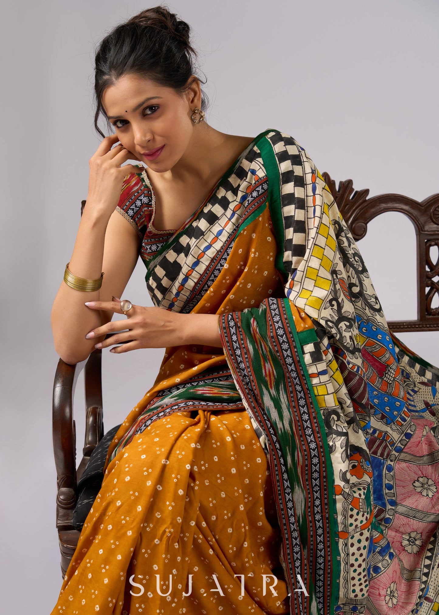 Vibrant yellow Bandhni print rayon saree with hand painted Madhubani art