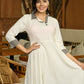 Monochrome Muse Off-White Flowy Dress with Checkered Accents
