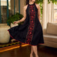 Black bias-cut block print halter dress with a red jaal hand block printed front panel, golden print detailing, and red accents for a striking, elegant statement look.