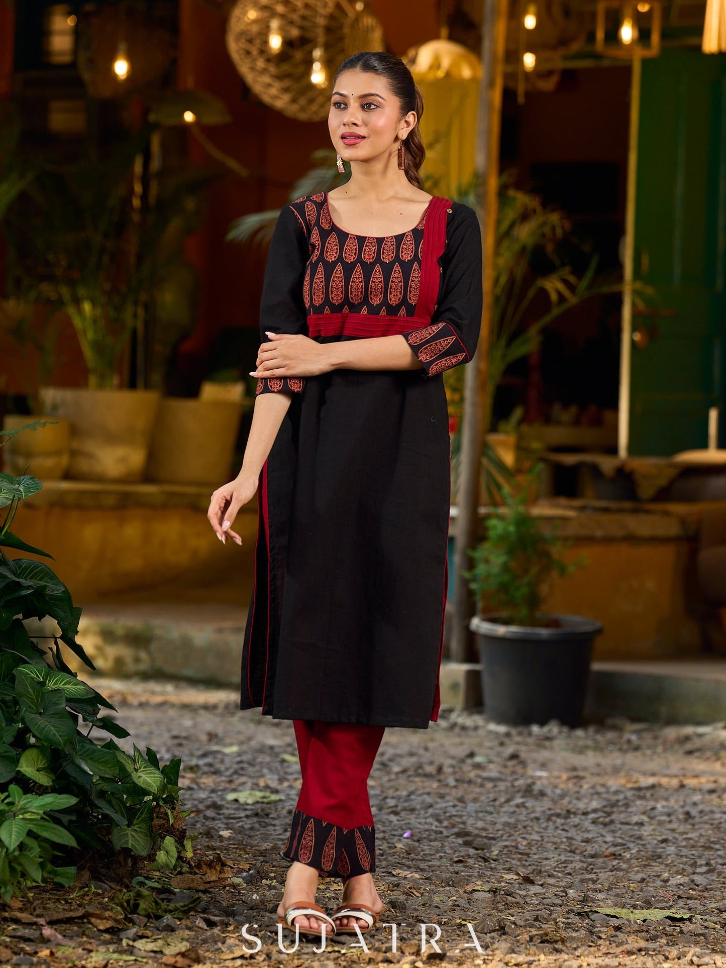 Elegant black kurta featuring an Ajrakh leaf patch across the neck panel