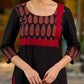 Elegant black kurta featuring an Ajrakh leaf patch across the neck panel
