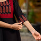 Elegant black kurta featuring an Ajrakh leaf patch across the neck panel
