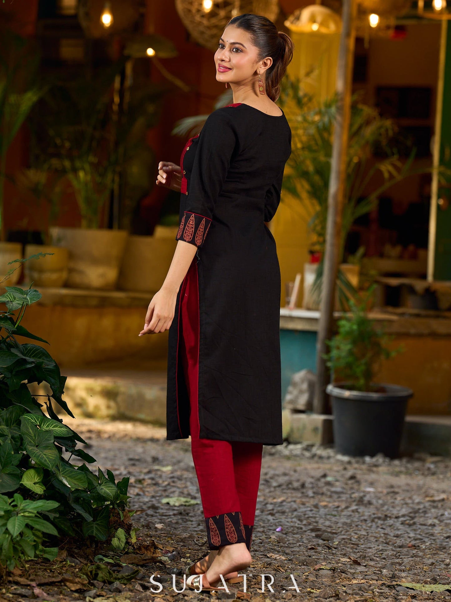 Elegant black kurta featuring an Ajrakh leaf patch across the neck panel