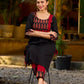 Elegant black kurta featuring an Ajrakh leaf patch across the neck panel