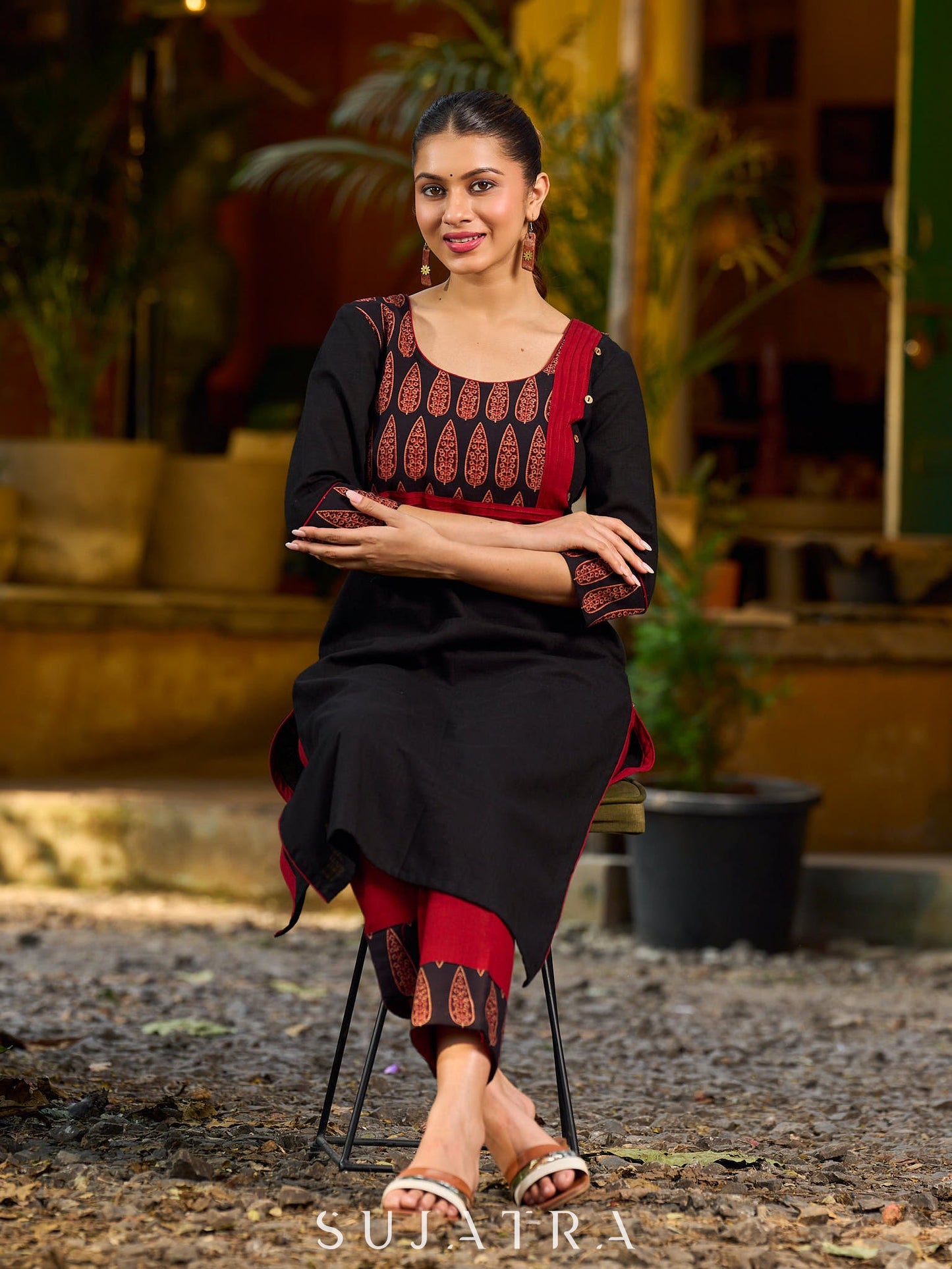 Elegant black kurta featuring an Ajrakh leaf patch across the neck panel