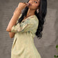 Soft green Kalamkari printed collared dress with centre pleat detailing.