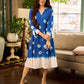Refreshing cobalt blue shibori tie-dye dress with ivory accents and delicate lace-trimmed neckline.