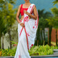 Artisanal White Georgette Saree with Red Embroidered Motifs & Beaded Border Trim