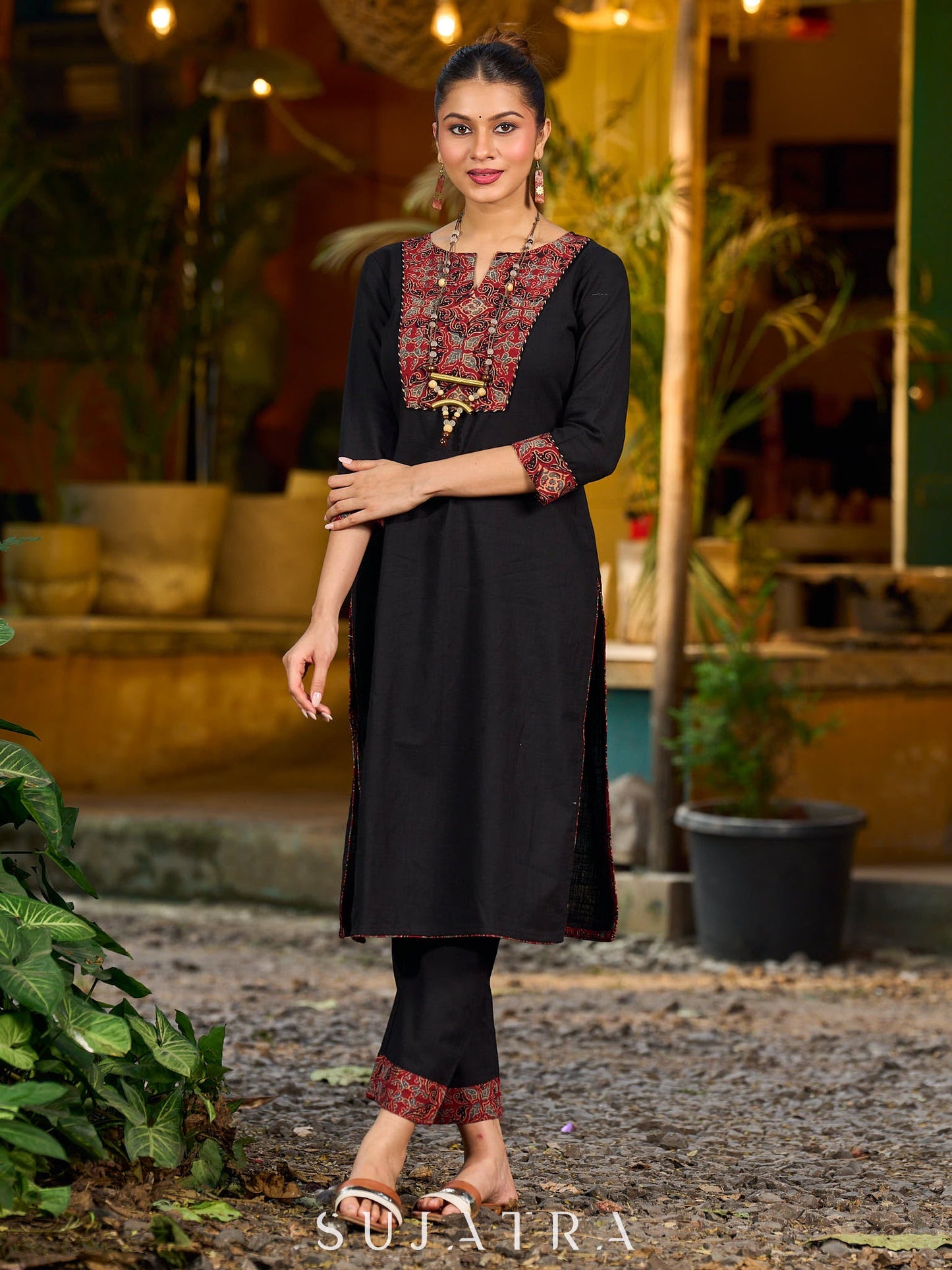 elegant black cotton kurta with beautifully crafted ajrakh panel and subtle stripe piping accents
