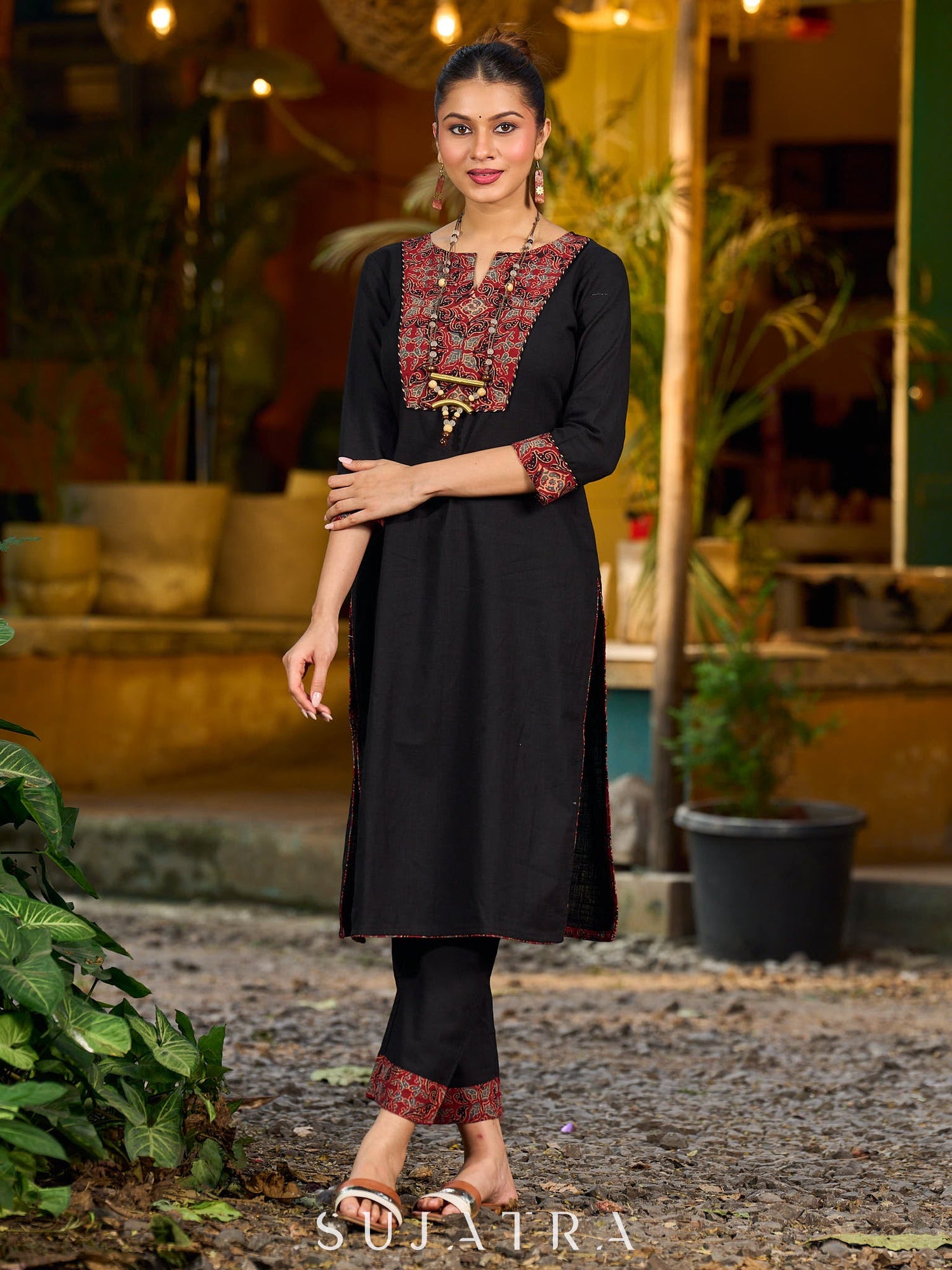 elegant black cotton kurta with beautifully crafted ajrakh panel and subtle stripe piping accents