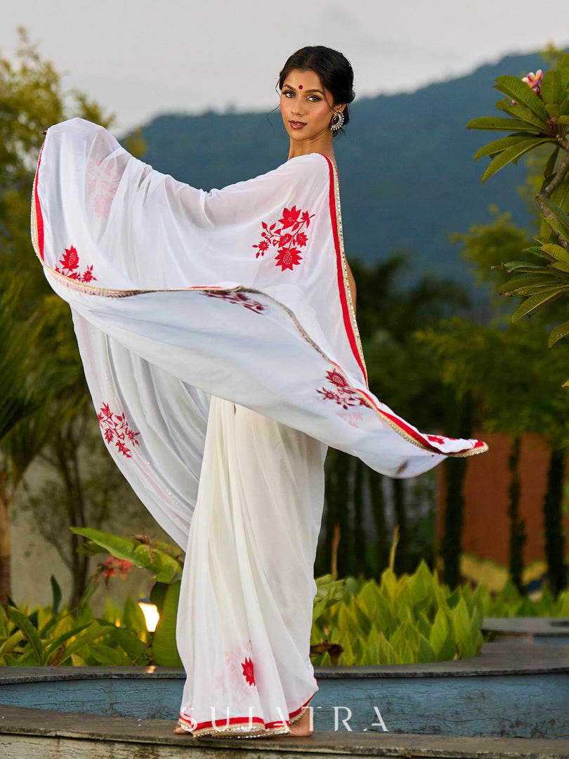 Artisanal White Georgette Saree with Red Embroidered Motifs & Beaded Border Trim