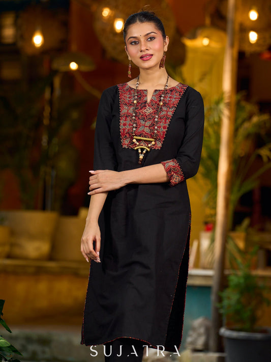 elegant black cotton kurta with beautifully crafted ajrakh panel and subtle stripe piping accents
