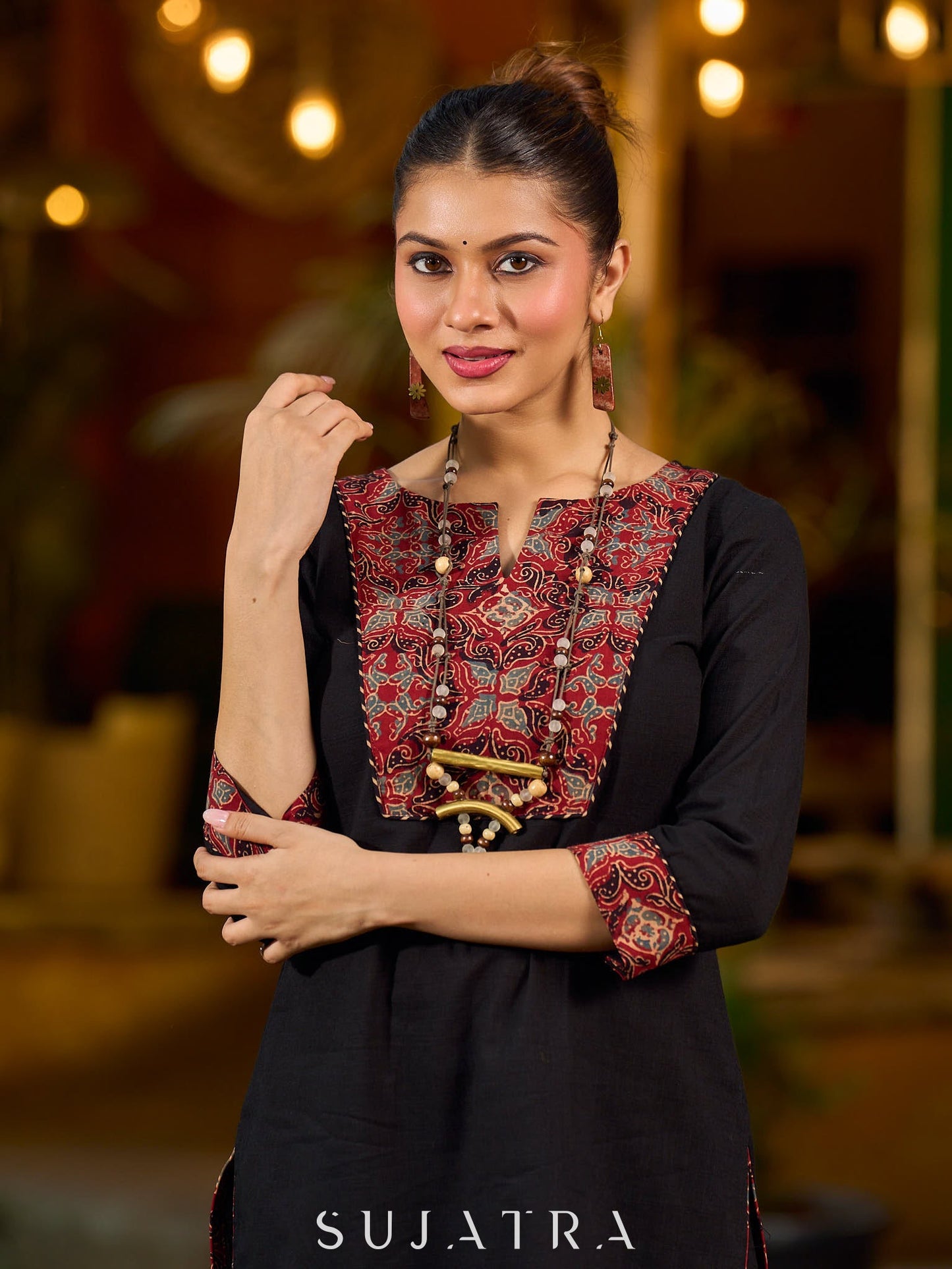 elegant black cotton kurta with beautifully crafted ajrakh panel and subtle stripe piping accents