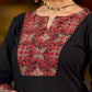 elegant black cotton kurta with beautifully crafted ajrakh panel and subtle stripe piping accents