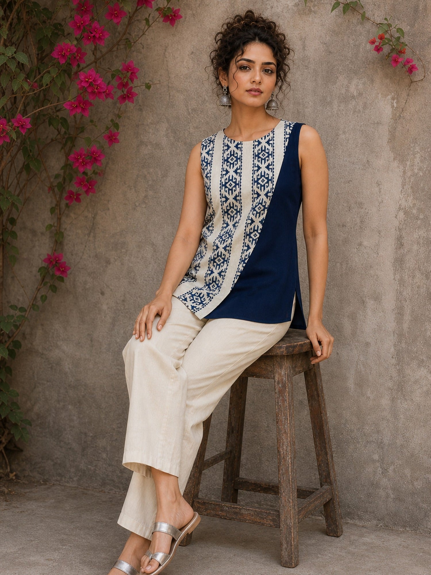 Contemporary off white and navy hand block print top featuring striking geometric motifs, an asymmetric layered silhouette, and effortless elegance