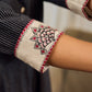 Timeless black stripes accented with exquisite hand-painted Madhubani on collars and cuffs