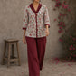 Soft white floral cotton top finished with maroon cuffs, pleated collar, and delicate feminine elegance.