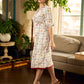 Soft off-white block printed rayon dress with intricate all-over hand block printed checks and florals, a gently gathered yoke, and rich red accents for a refined, elegant everyday look.