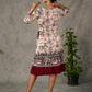 Beige traditional printed dress with rich maroon accents.