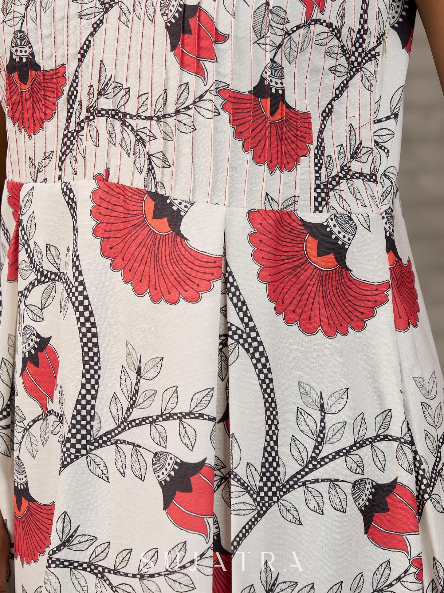 White and orange Kalamkari printed dress with elegant pintuck detailing
