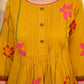 Mustard block printed pintuck dress with hand block red and pink vine floral motifs, accented with red and olive details for a rich, elegant look.