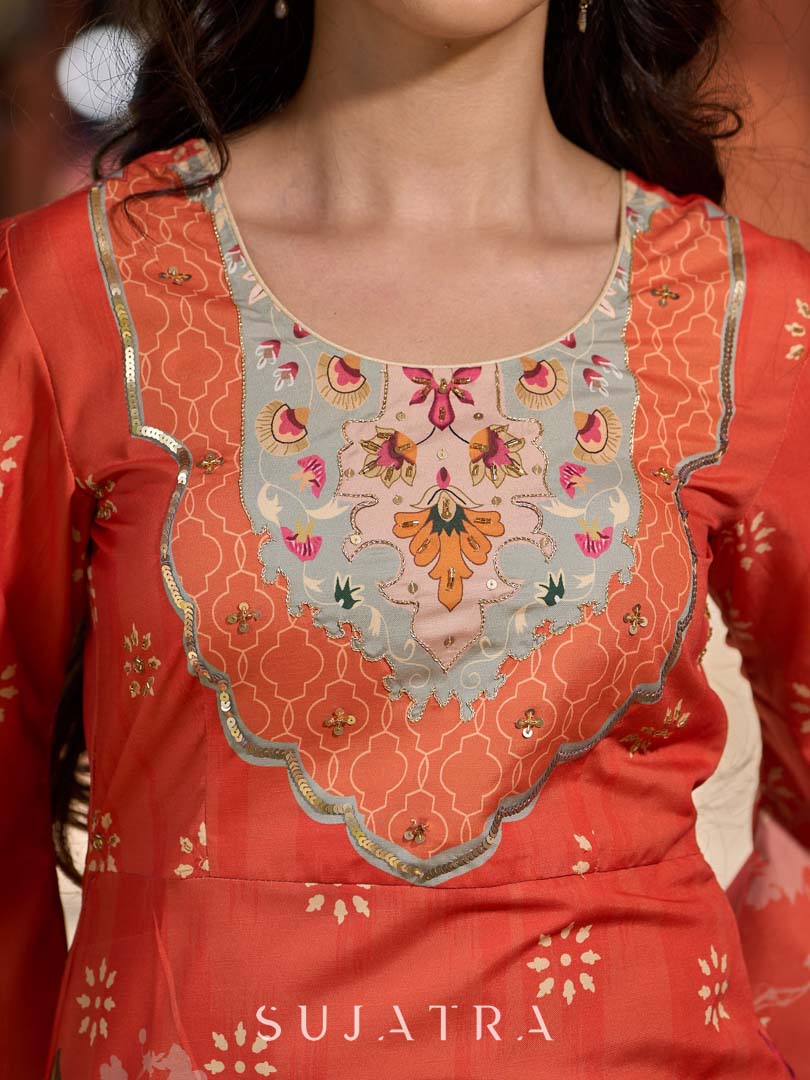 Elegant orange floral printed kurta with hand-embroidered sequin and cut dana detailing on the yoke and rich maroon accents.