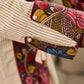 White and black striped dress with Kalamkari panel and tie-up neckline.