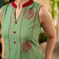 Pista sleeveless block printed dress with red abstract motif panels, a contrasting red collar, and accents for a fresh, artisanal, contemporary look.