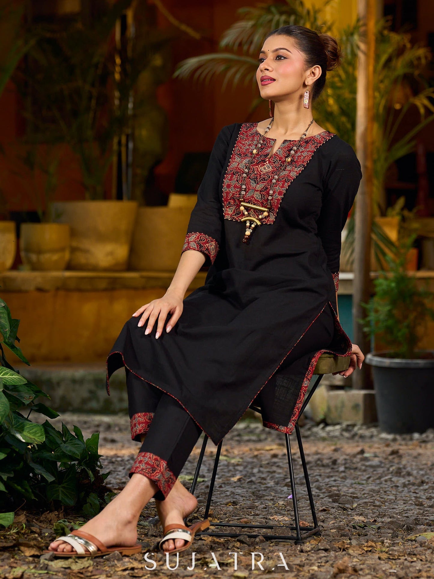 elegant black cotton kurta with beautifully crafted ajrakh panel and subtle stripe piping accents
