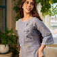 Two-tone handloom cotton dress with delicately painted Madhubani fish motifs and pleated hem.