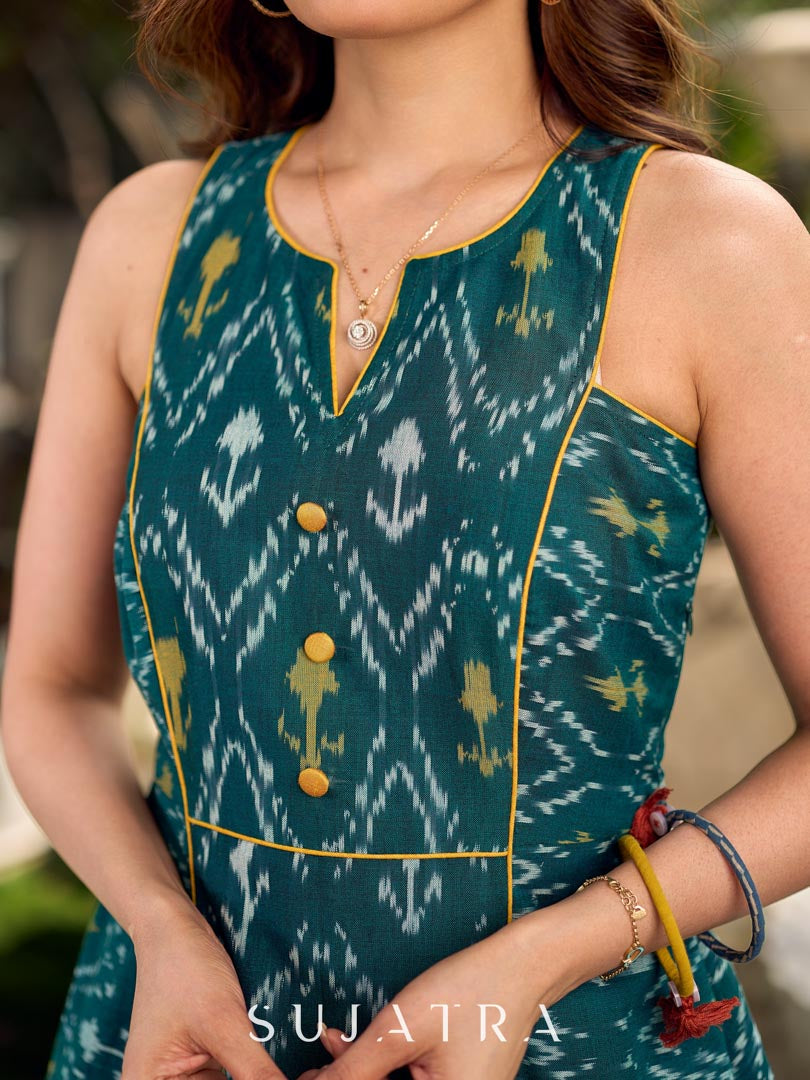 Elegant green and yellow mercerised Ikat dress featuring bold yellow accents and a sculpted-armhole sleeveless silhouette