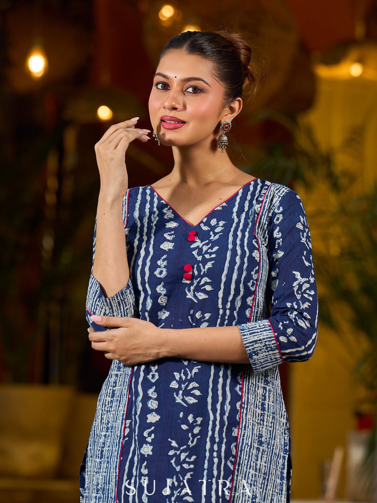 Indigo kurta elevated with delicate pink piping and buttons