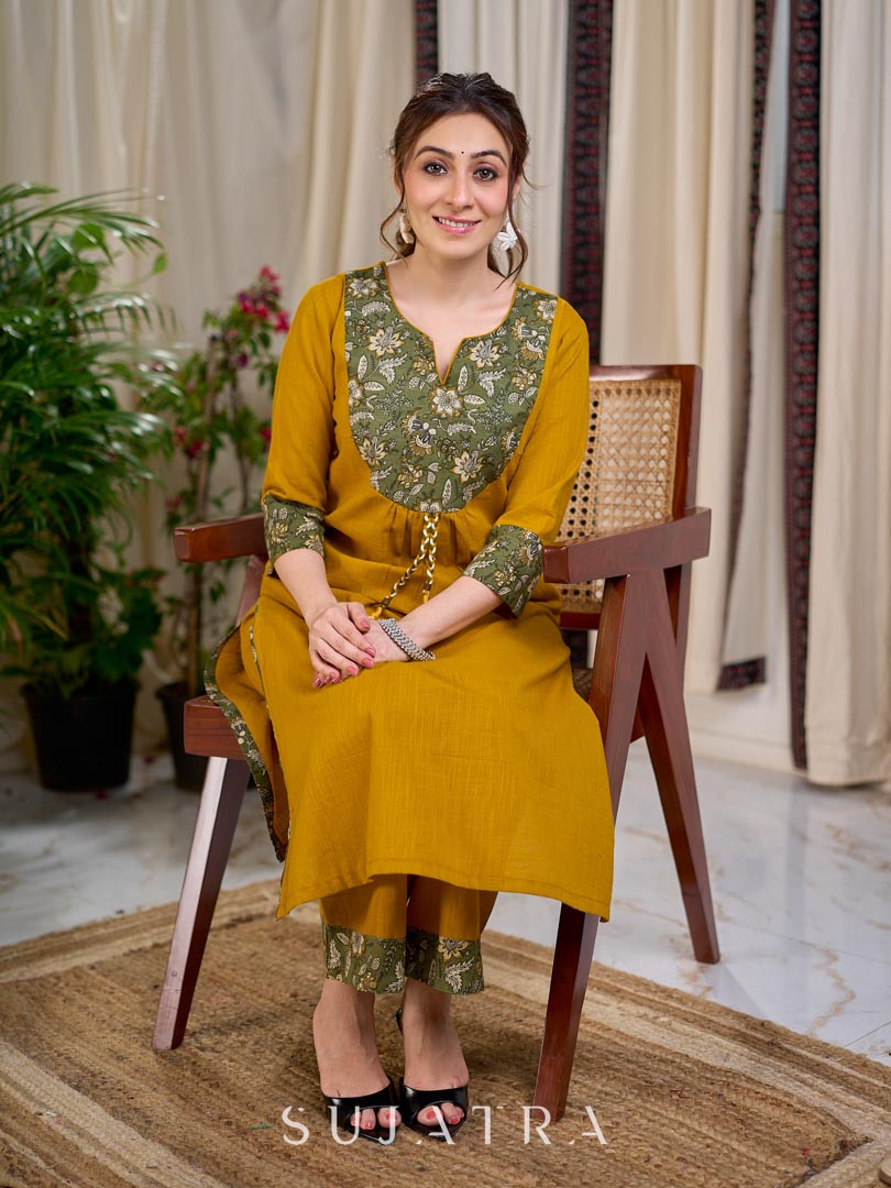 Vibrant Mustard Cotton Kurta with Olive Floral Print Yoke and Statement Tassel Embellishment