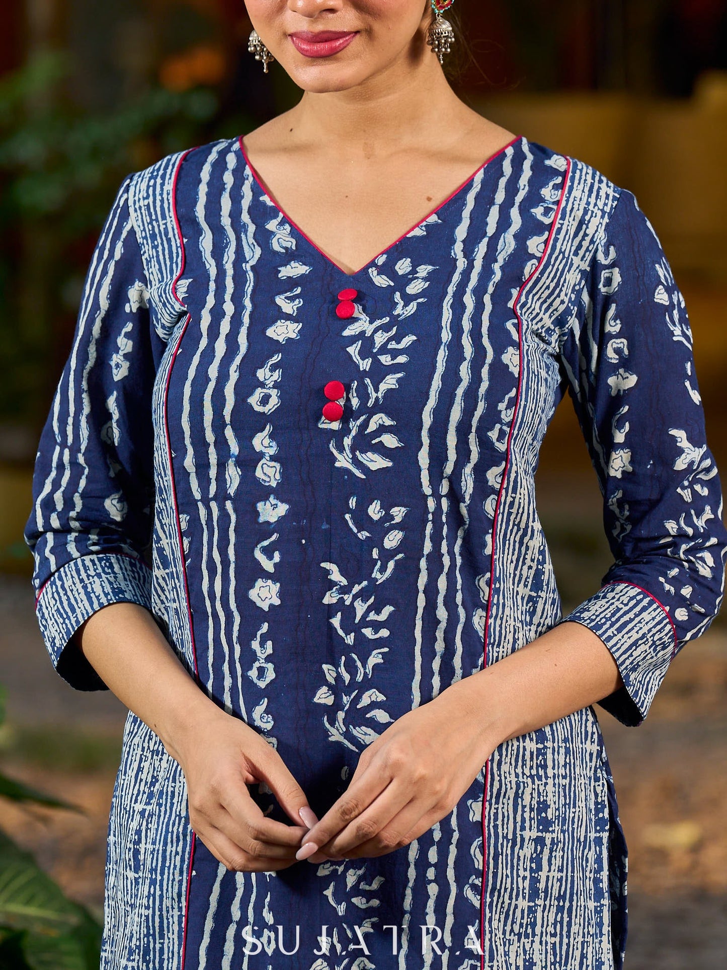 Indigo kurta elevated with delicate pink piping and buttons