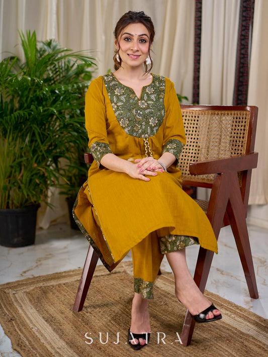 Vibrant Mustard Cotton Kurta with Olive Floral Print Yoke and Statement Tassel Embellishment