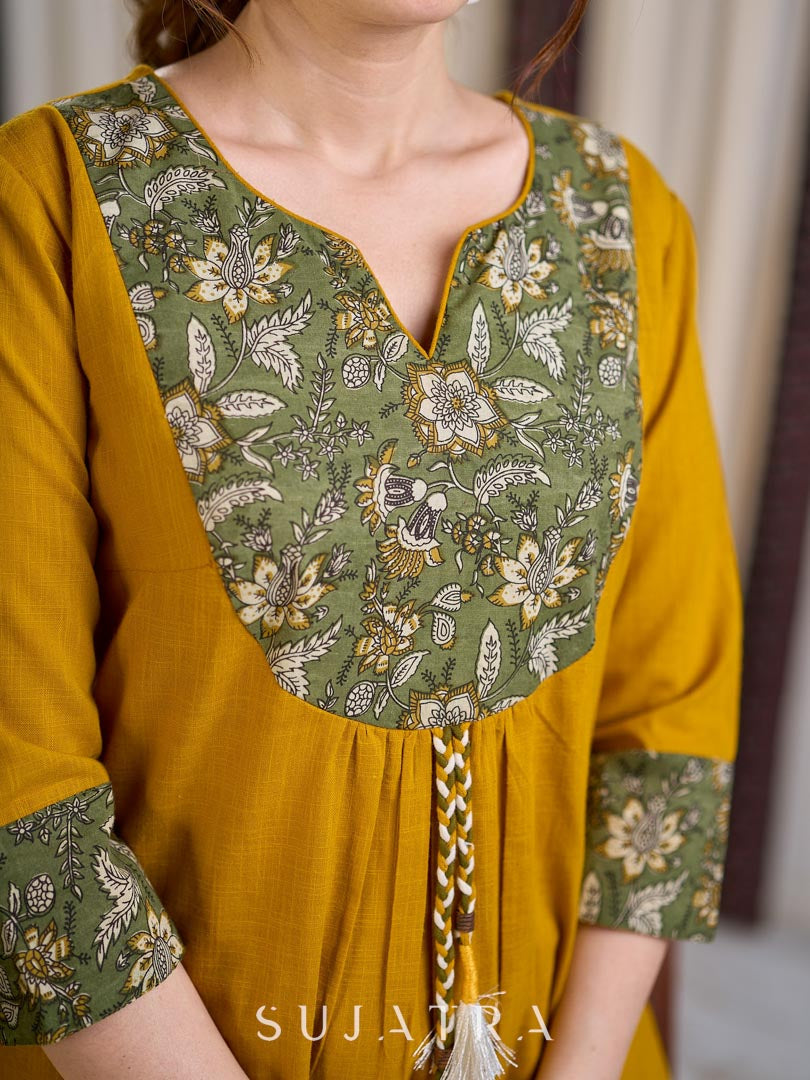 Vibrant Mustard Cotton Kurta with Olive Floral Print Yoke and Statement Tassel Embellishment